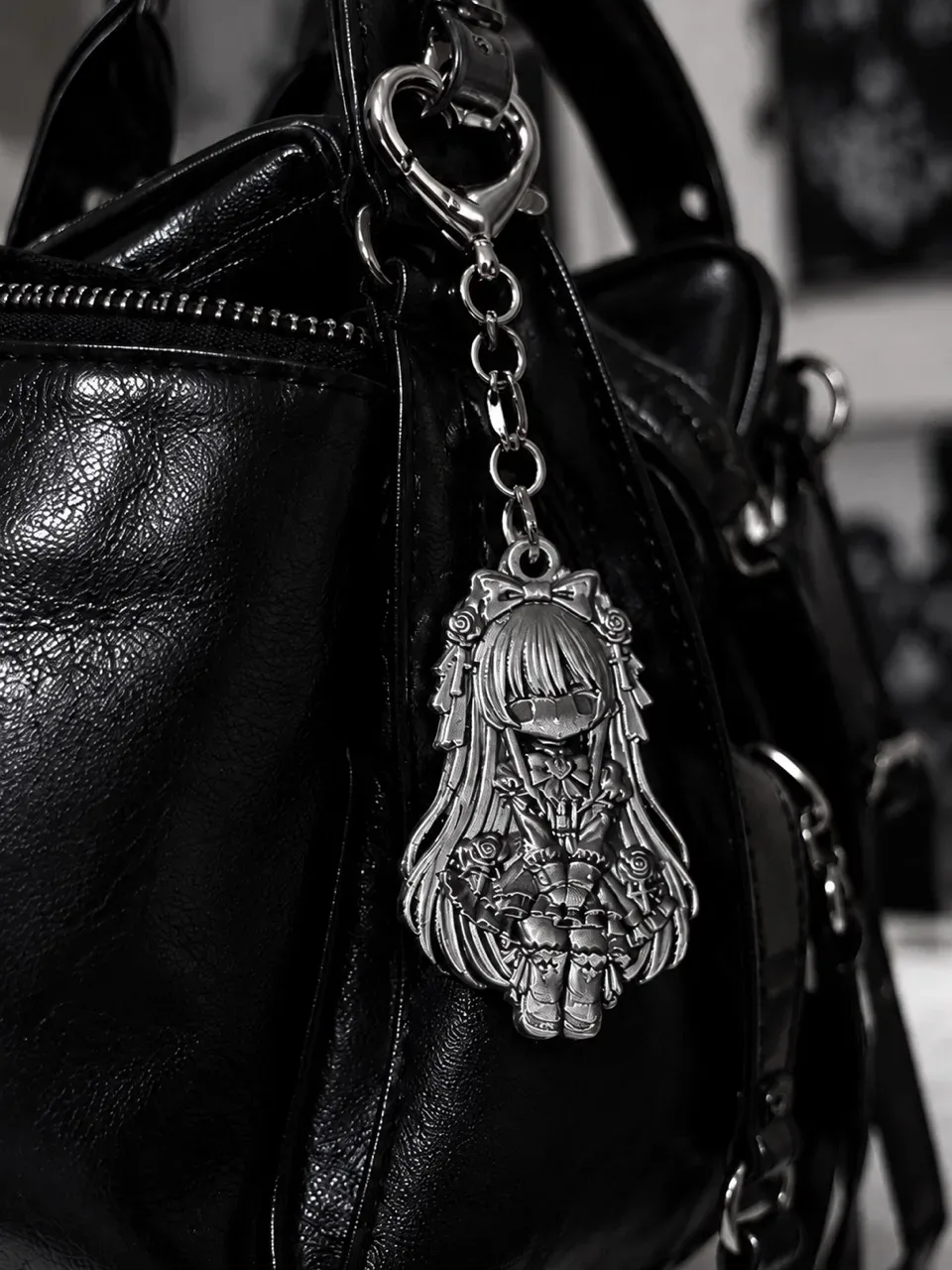 Misojo Keychain styled on a black bag